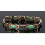 14 carat gold jade set bracelet, with six green jade panels and Chinese calligraphy links, 17.5cm