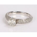 9 carat white gold diamond set ring, the central 1 carat diamond with a further 0.60 carats to the