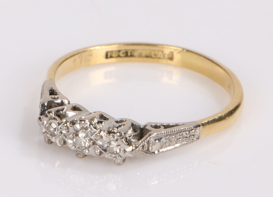 18 carat gold diamond set ring, with three diamonds to the head, ring size N