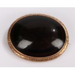 9 carat gold mounted agate brooch, the oval agate within a 9 carat gold mount, 50mm diameter