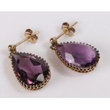 Amethyst set earrings, the pear cut amethyst drops set into the claw mounts, 20mm long