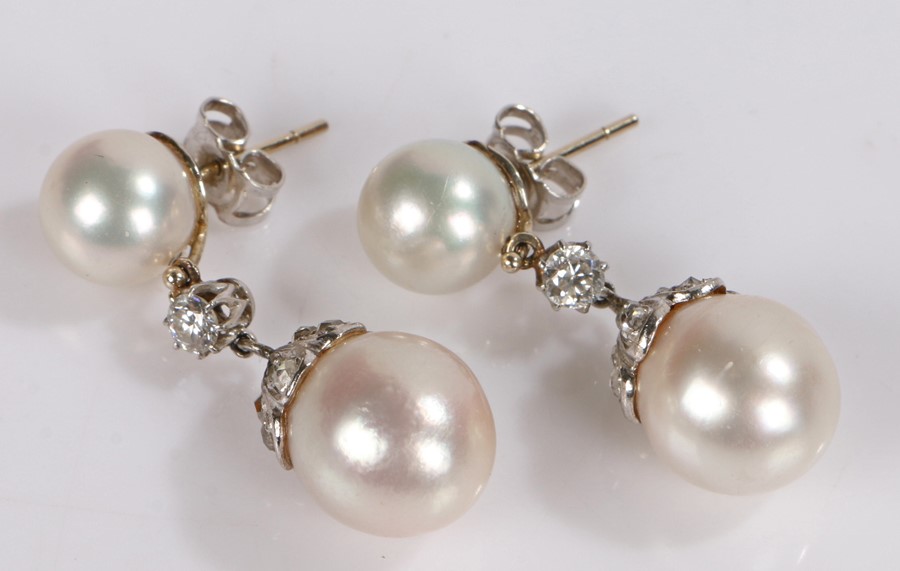 Pair of pearl and diamond set earrings, the drops with two pearls set with diamonds to the link
