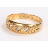 18 carat gold diamond set ring, with three diamonds set to stars, ring size M
