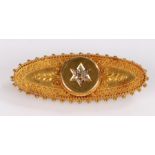15 carat gold and diamond brooch, of oval form with beaded border and central arrangement of seven