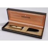 Sheaffer fountain pen, the black body with 14 carat gold nib and plated cap, housed in original box