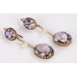 Pair of amethyst and pearl set earrings, with two oval amethysts and a pearl in-between, 48mm long