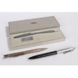 Cross, a boxed ball point pen, a silver retracting pencil and a Sheaffer ball point pen, (3)