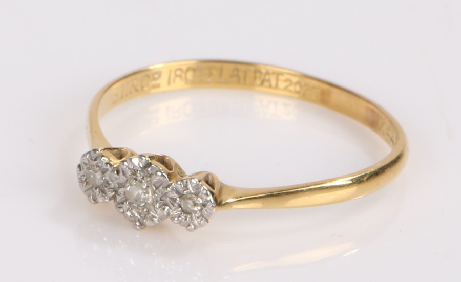 18 carat gold diamond set ring, with three diamonds set to the head, ring size P1/2