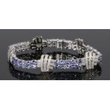 14 carat white gold, diamond and tanzanite bracelet, with five sections of overlapped diamonds