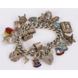 Silver charm bracelet, with various charms attached, 102 grams