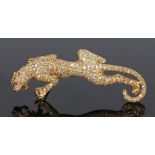 18 carat gold diamond set brooch, in the form of a tiger low on all fours, set with over two hundred