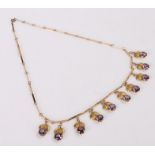 14 carat gold amethyst set necklace, the amethysts forming flower drops, 50cm long