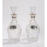 Pair of Elizbeth II silver mounted decanters, London 1967, the angled stoppers above the grape and