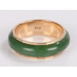 12 carat gold ring, set with jade type surround and internal gold ring, ring size T1/2