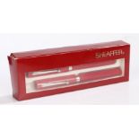 Sheaffer pen set, in red, to include a fountain pen and a ball point pen, cased