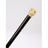 Victorian ivory walking cane, the head carved as a parrot with orange eyes, 92cm long