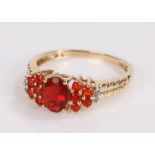 9 carat gold ring, set with red stones, ring size N1/2