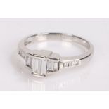 Art Deco style diamond set ring, with three baguette cut diamonds to the head and a further six