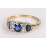 Sapphire and diamond set ring, with three oval sapphires at 1.04 carats in total and 0.20 carat of