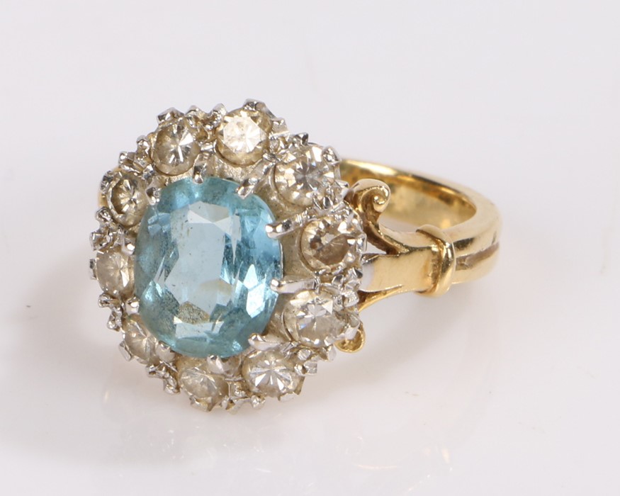 18 carat gold aquamarine and diamond ring, the central aquamarine with a diamond surround, ring size