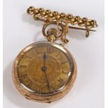 14 carat gold open face pocket watch, with Roman hours and foliate centre, crown wound, 32mm