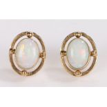 Pair of 9 carat gold opal earrings, with cabochon cut opals set into oval mounts, 11mm diameter