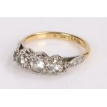18 carat gold and diamond set ring, with three round cut diamonds to the head, ring size L