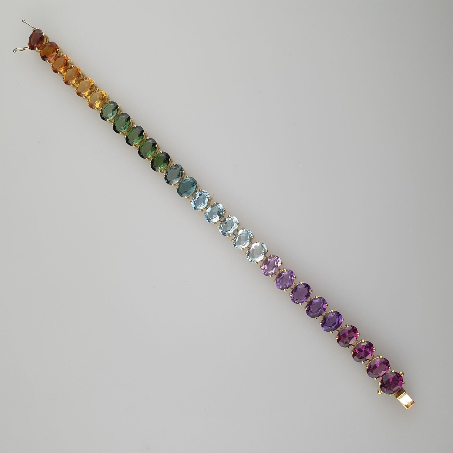 Multicolor-Armband - 18Kt.-Gelbgold, Goldschmiedearbeit, Besatz mit Amethysten, Blautopasen,