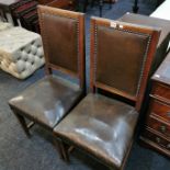 PAIR OF OAK SIDE CHAIRS WITH OLD LEATHER UPHOLSTERY