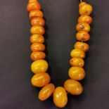 SET OF STRUNG AMBER BEADS