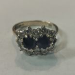 18CT GOLD SAPPHIRE AND DIAMOND RING