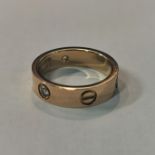 18CT GOLD AND DIAMOND CARTIER RING