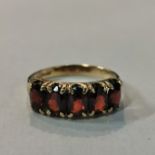 9 CARAT GOLD 5 STONE GARNET RING