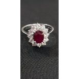 18CT WHITE GOLD RUBY AND DIAMOND RING WITH 1 CARAT OF DIAMONDS