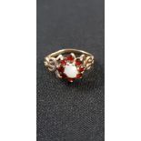 9 CARAT GOLD OPAL & GARNET RING