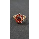 GOLD AND GARNET RING