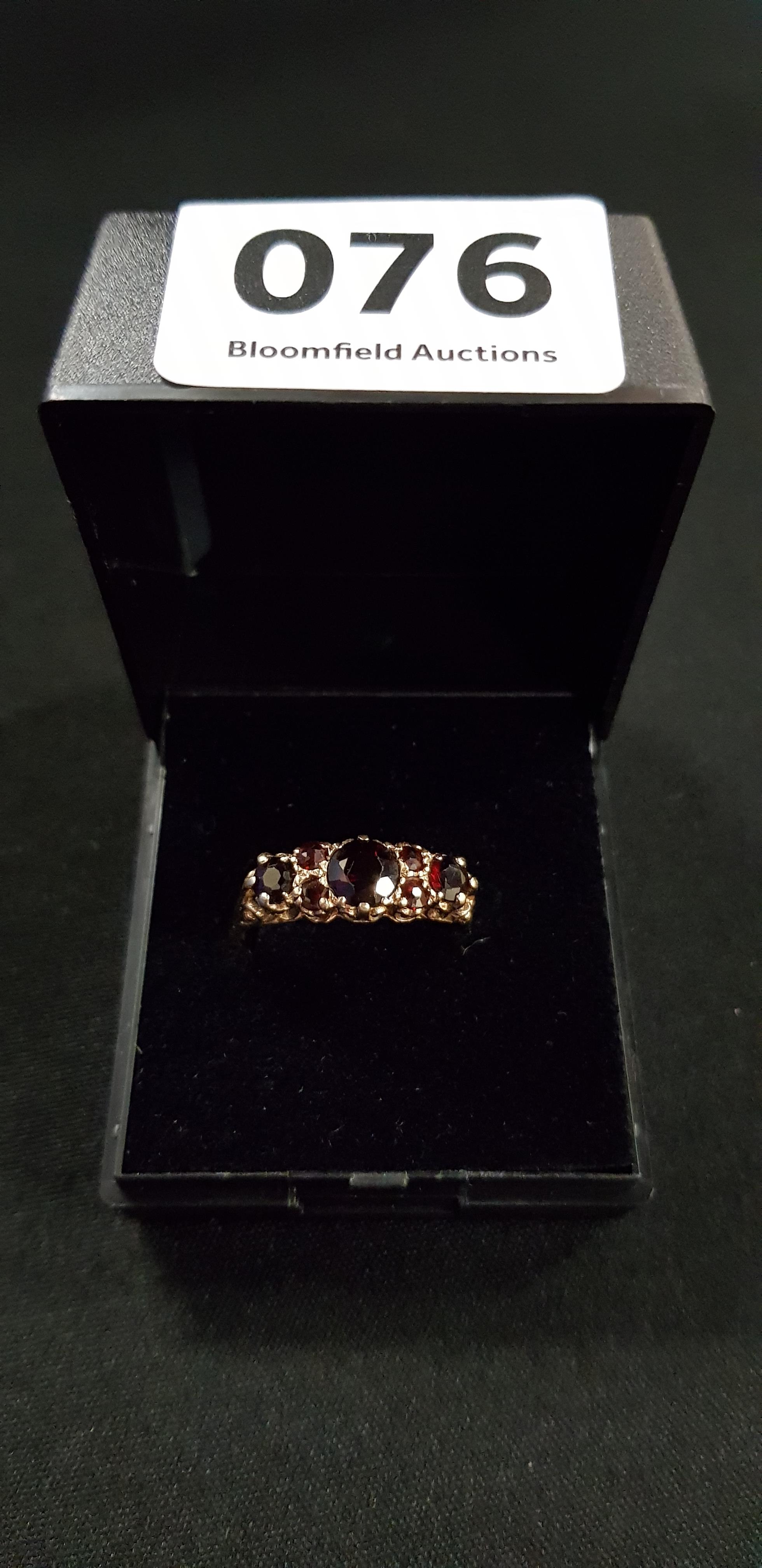 GOLD AND GARNET RING