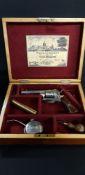 CASED 1893 7MM 6 SHOT PIN FIRE REVOLVER IN PRISTINE CONDITION WITH ALL NICKEL PLATING INTACT.