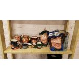 SHELF LOT OF DOULTON CHARACTER JUGS AND BOOK
