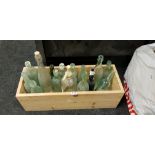 REDWOOD PLANTER WITH LOCALLLY NAMED BOTTLES