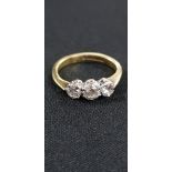 18CT YELLOW GOLD 3 STONE DIAMOND RING (0.85 CARAT)