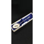 SILVER AND ENAMEL SPOON