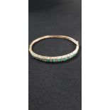9CT GOLD EMERALD AND DIAMOND BANGLE TOTAL WEIGHT 10.7G