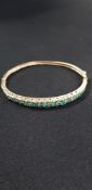 9CT GOLD EMERALD AND DIAMOND BANGLE TOTAL WEIGHT 10.7G