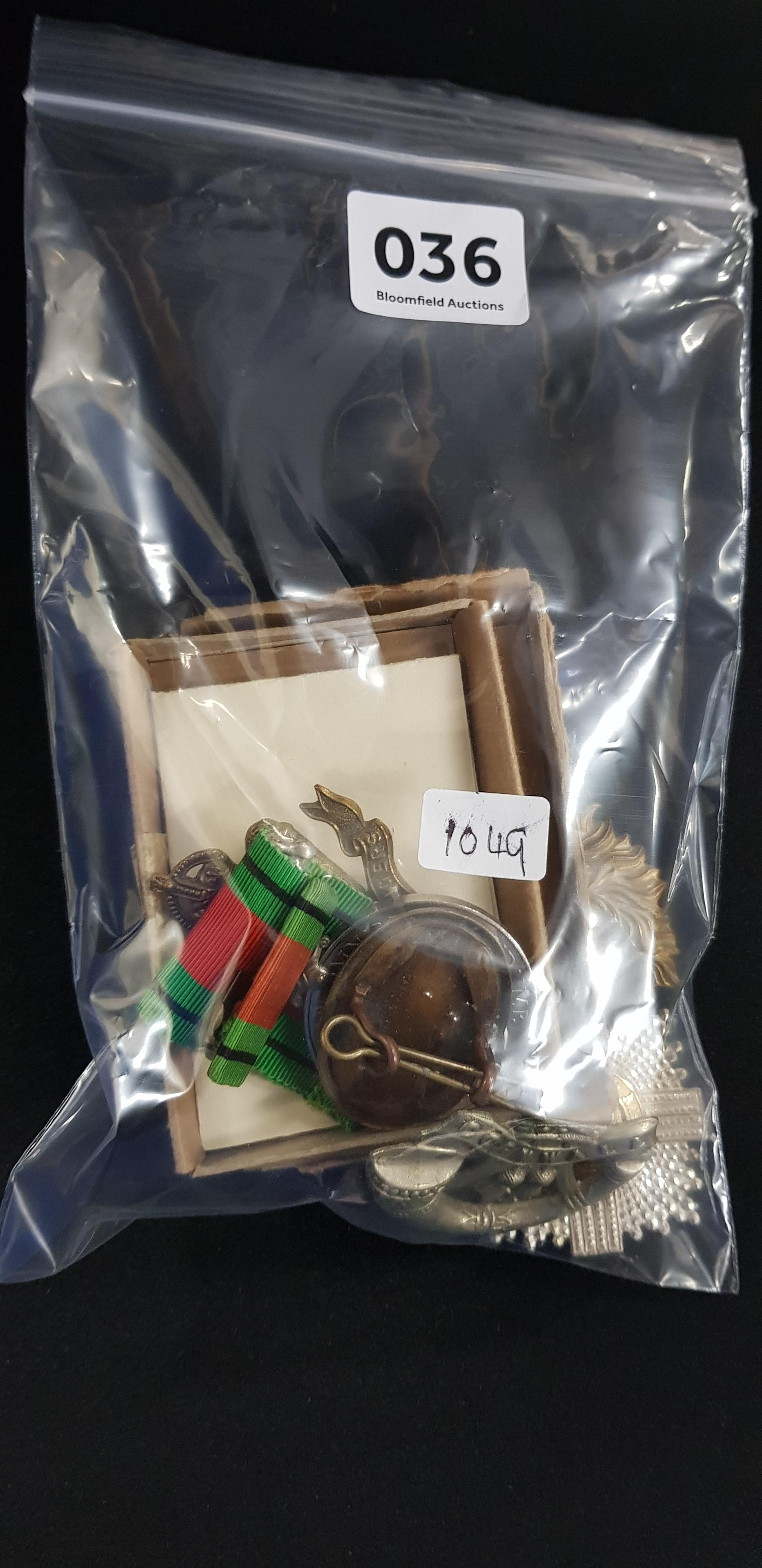 BAG OF MILITARY BADGES AND MEDALS