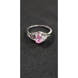 18CT DIAMOND AND PINK TOPAZ RING