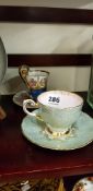 HAND PAINTED CUP AND SAUCER AND 1 OTHER