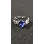 18CT WHITE GOLD TANZANITE AND DIAMOND RING