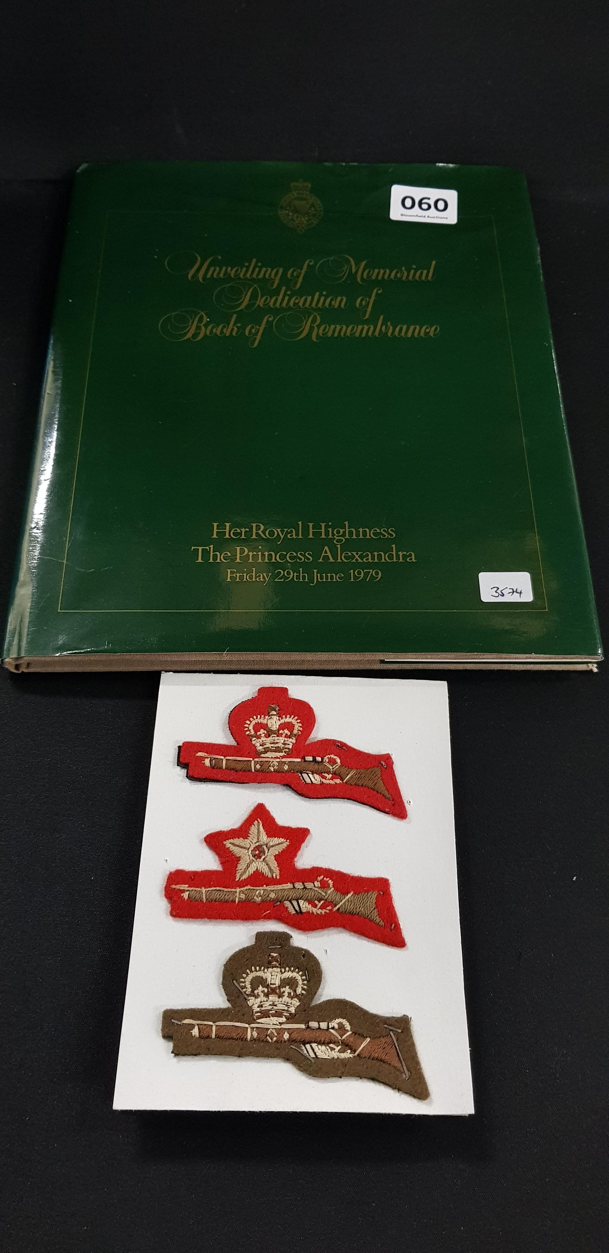 RUC REMEMBRANCE BOOK AND MILITARY BADGES