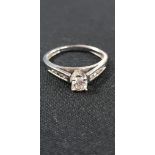 PLATINUM DIAMOND SOLITAIRE RING WITH DIAMOND ON SHANKS